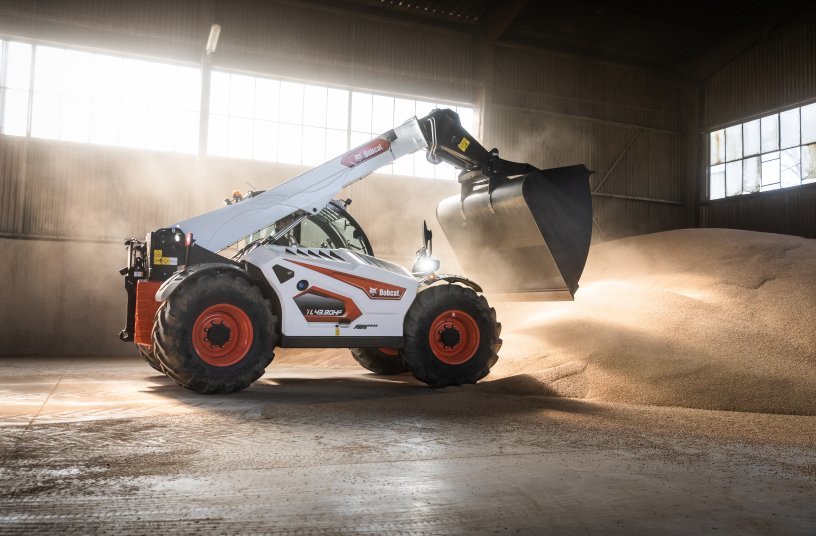 Bobcat telehandler with bucket attachment in a warehouse